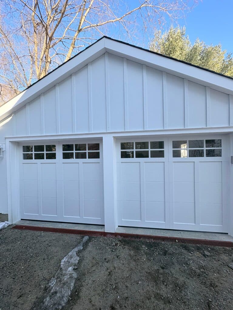 Pair of white carriage-style garage doors