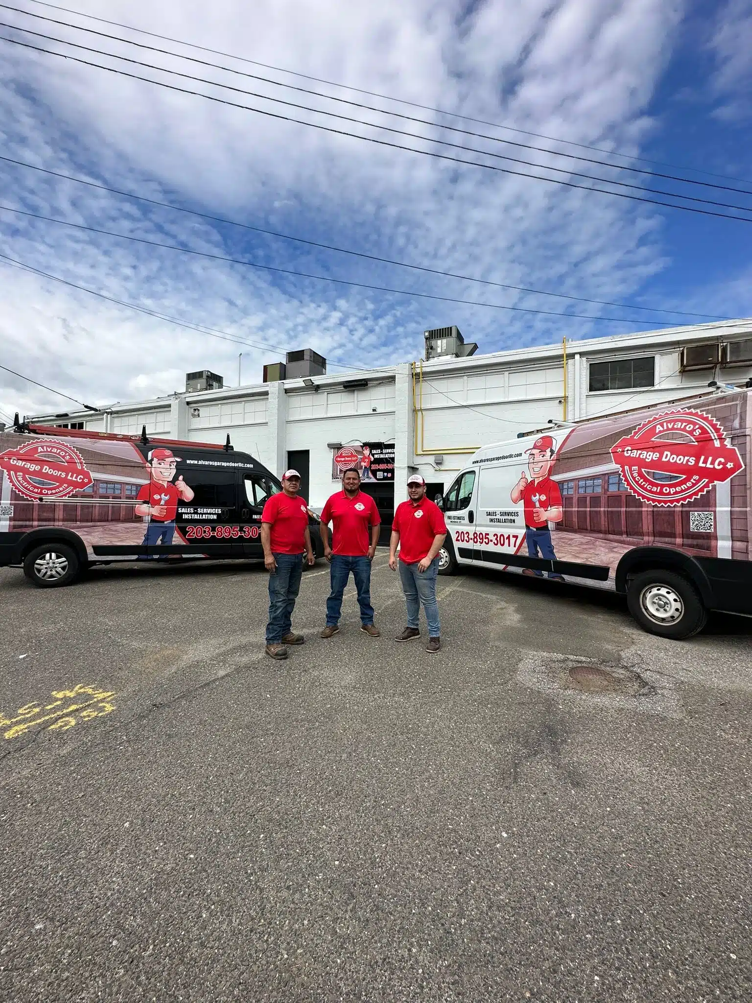 Alvaro's Garage Doors team with service vans — Monroe, CT